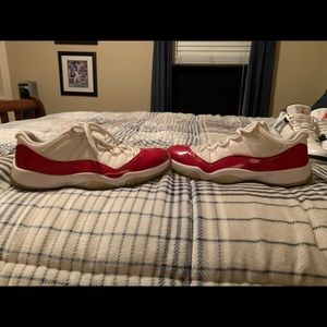 Jordan 11 low cherry red